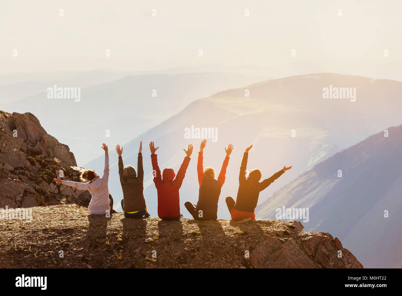 Happy friends having fun at mountain top Stock Photo