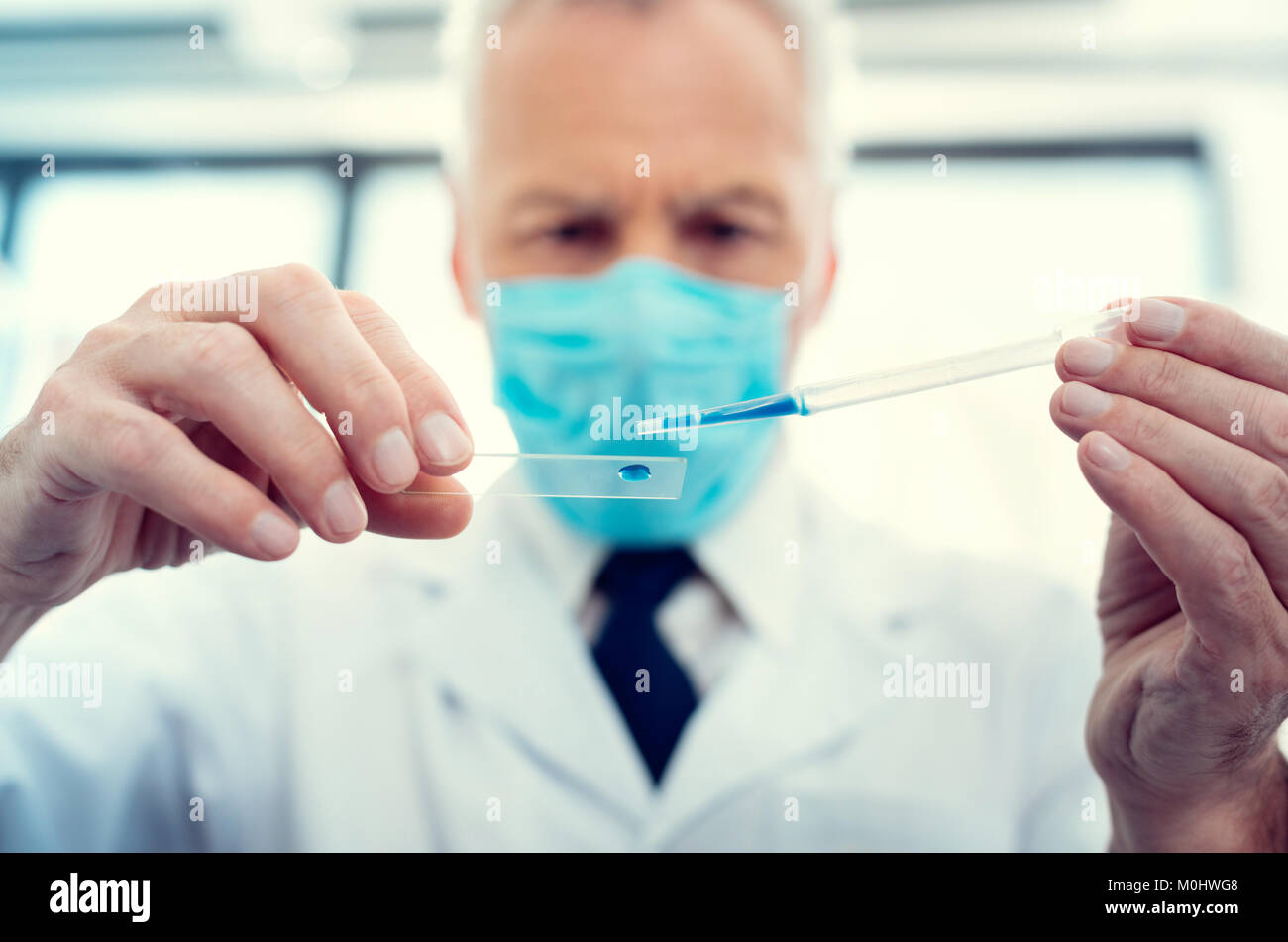 Sample Taker Lab Scaled up look on researcher taking sample in lab Stock Photo - Alamy