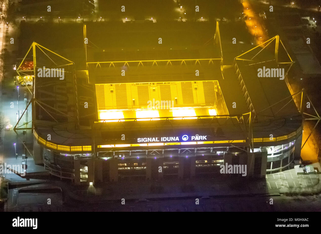 Aerial view, Westfalenstadion Dortmund, glowing soil heating, yellow black, SignalIdunaPark, Signal Iduna Park, BVB Stadion Dortmund city crown area W Stock Photo