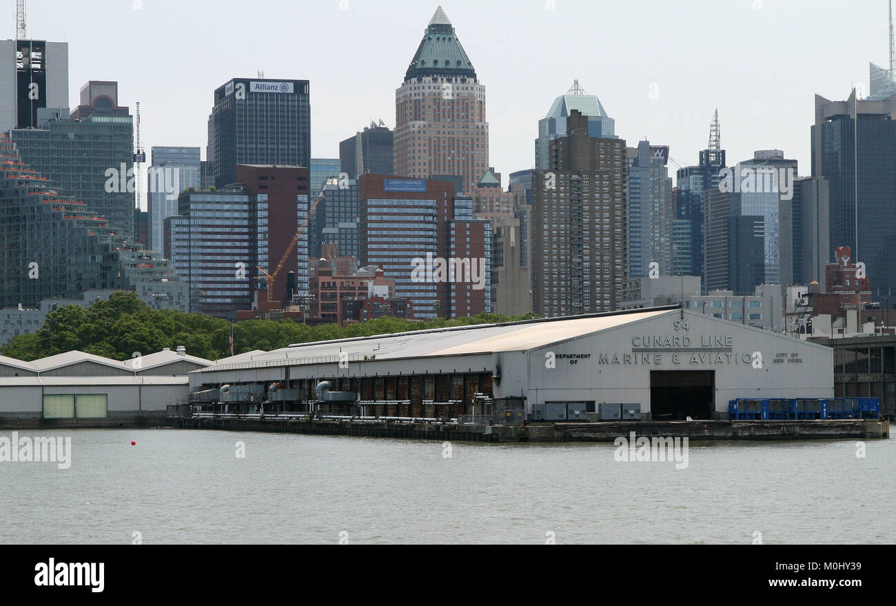 Pier 94 (former Department of Marine & Aviation Cunard Line freight pier now housing the UnConvention Center for trade shows) with Midtown West Manhat Stock Photo