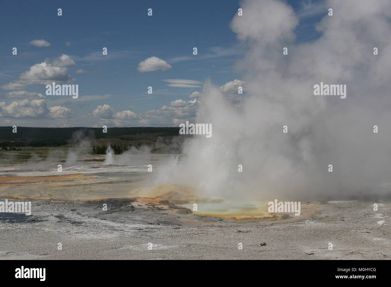 The Clepsydra Geyser erupts in the Lower Geyser Basin at the Yellowstone National Park July 28, 2009 in Wyoming. Stock Photo