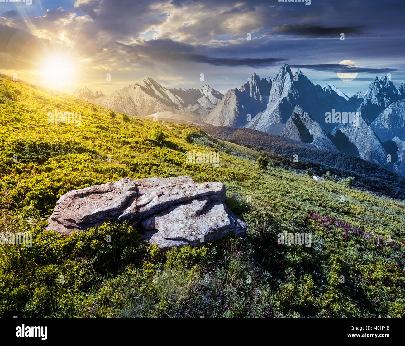 time change concept over the composite landscape with meadow in rocky mountains. beautiful unrealistic landscape in summertime with sun and moon Stock Photo