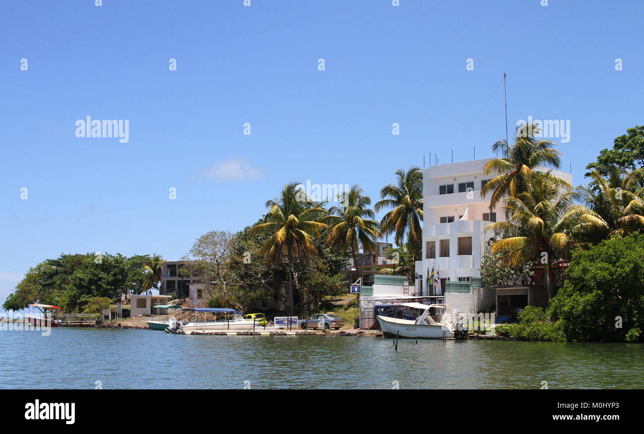 Privately owned houses on the bank of the Grand River, Flacq District, The Republic of Mauritius. Stock Photo