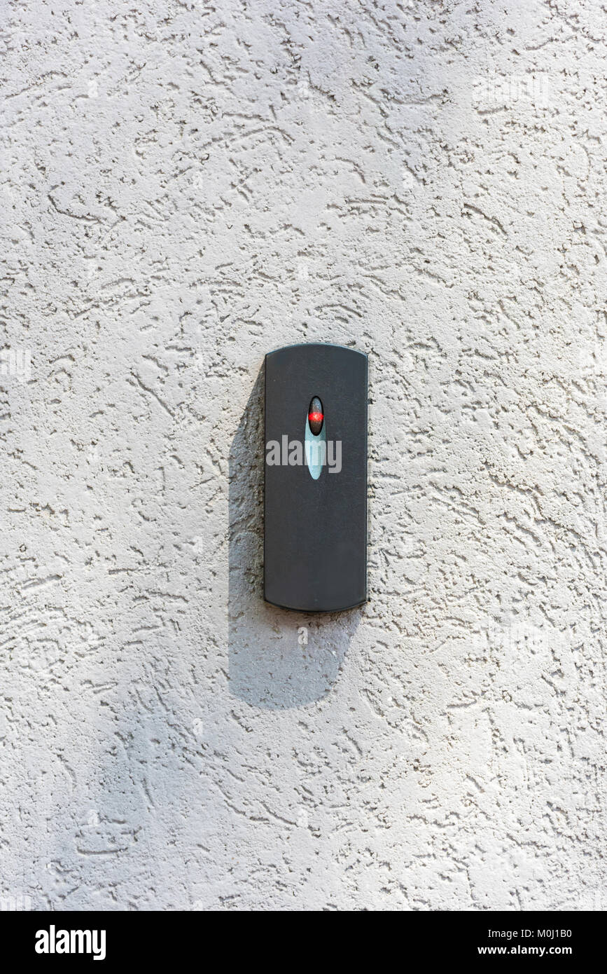 close up of door access control on white concrete wall Stock Photo
