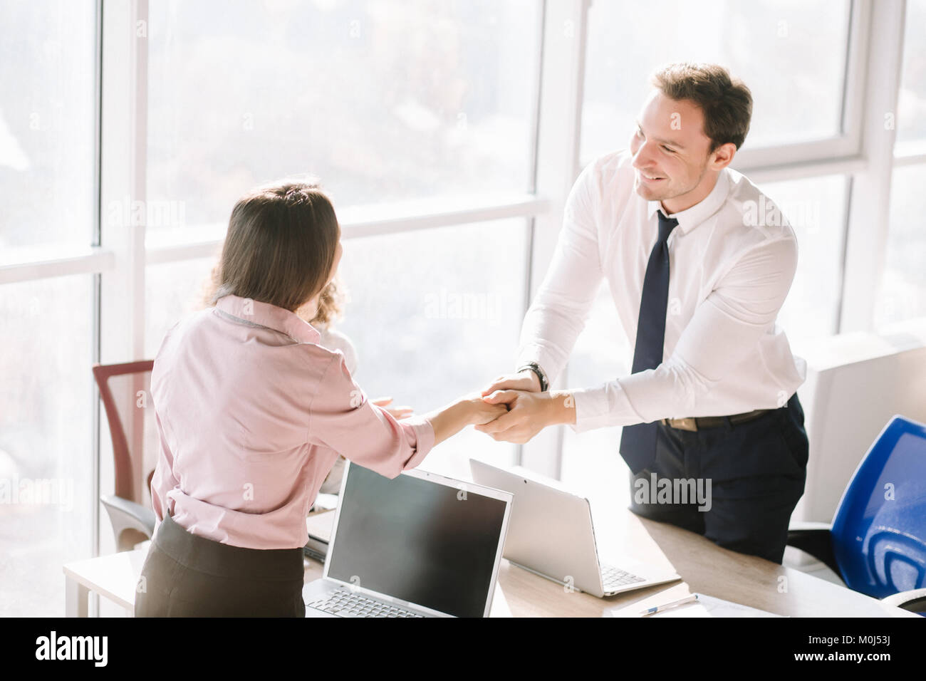 Businessman cheering desk in office hi-res stock photography and images ...