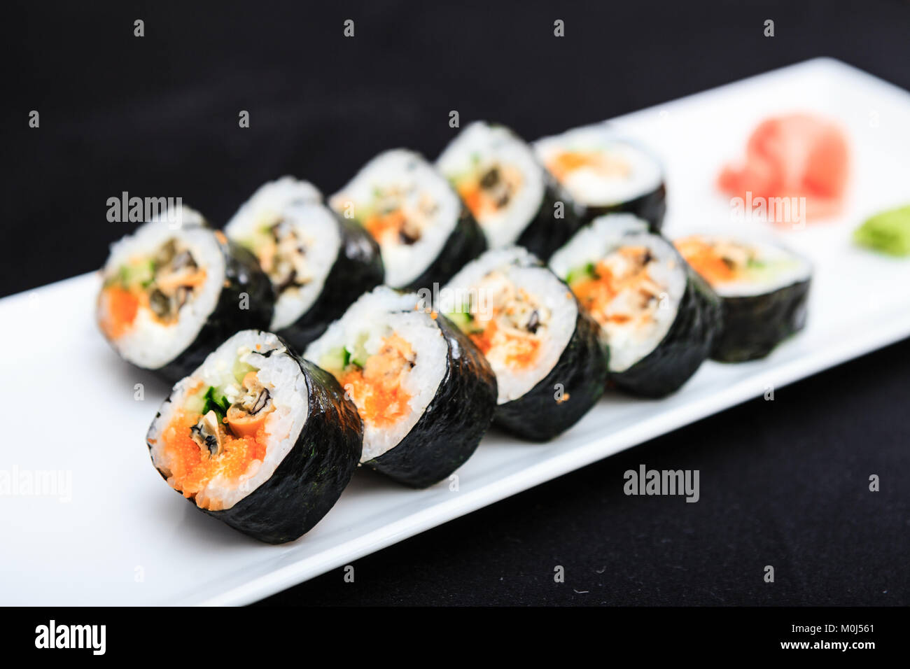 Seashell roll served on a plate Stock Photo - Alamy