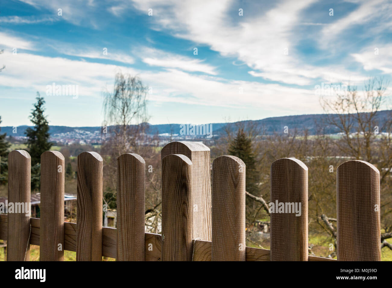 Wooden fence of a little garden and view down the valley Stock Photo ...