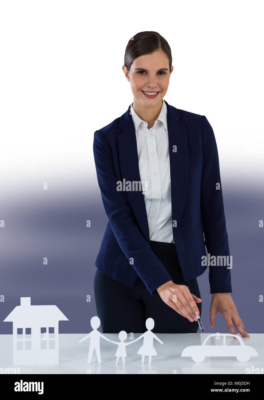 Paper Cut Out family with home and car and businesswoman Stock Photo