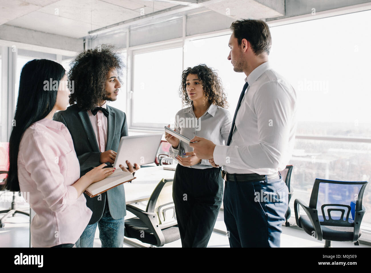 Good Work Discussions Young team of coworkers making great meeting discussion Stock Photo - Alamy