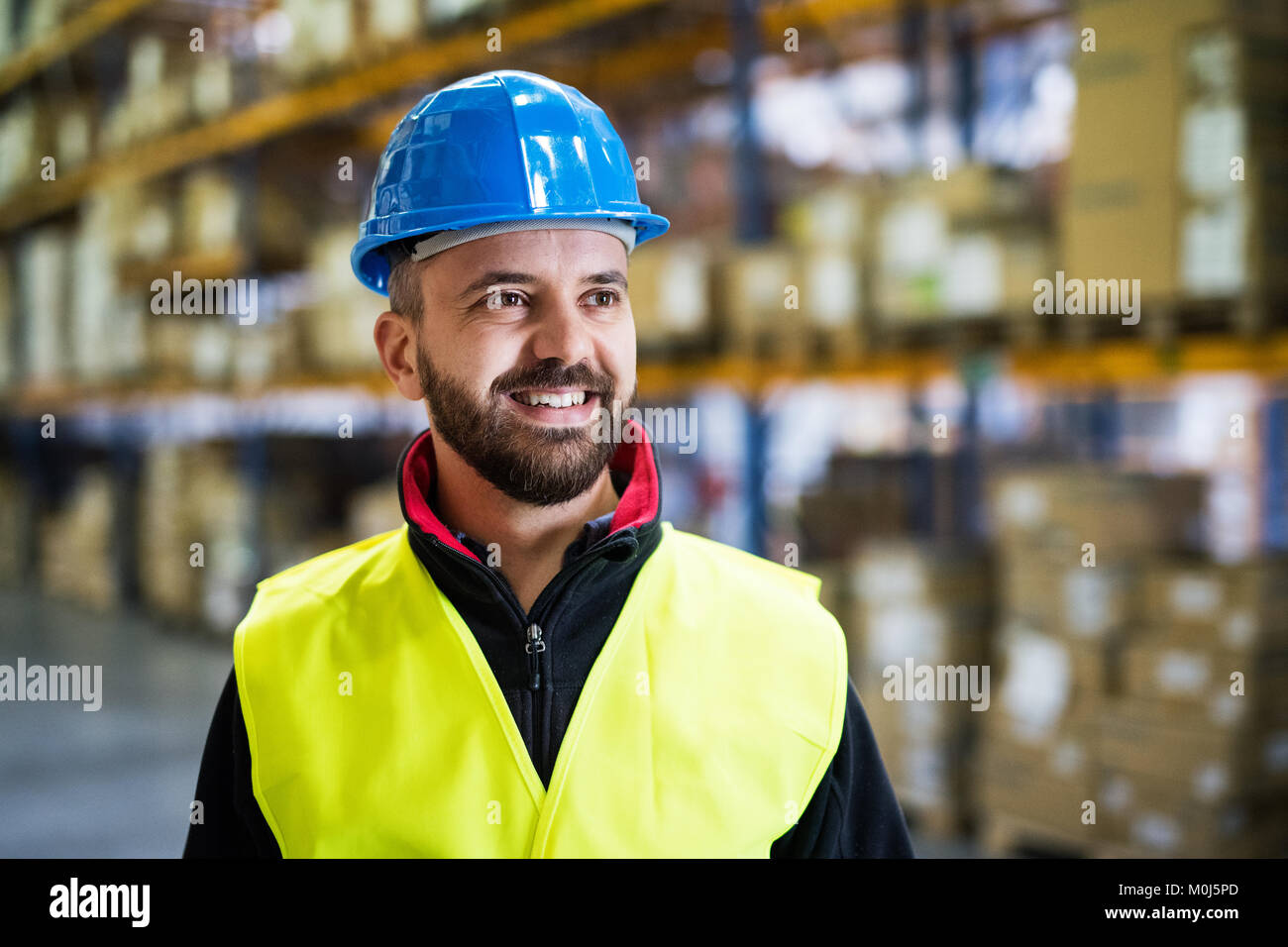 Portrait of a male warehouse worker Stock Photo - Alamy