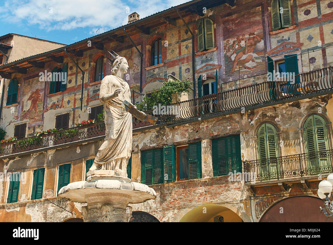 Ancient Statue of Madonna Verona on Piazza delle Erbe, Italy Stock