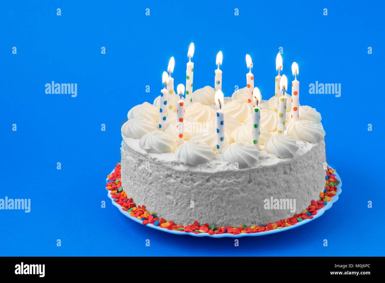 Birthday cake on a colored background Stock Photo - Alamy