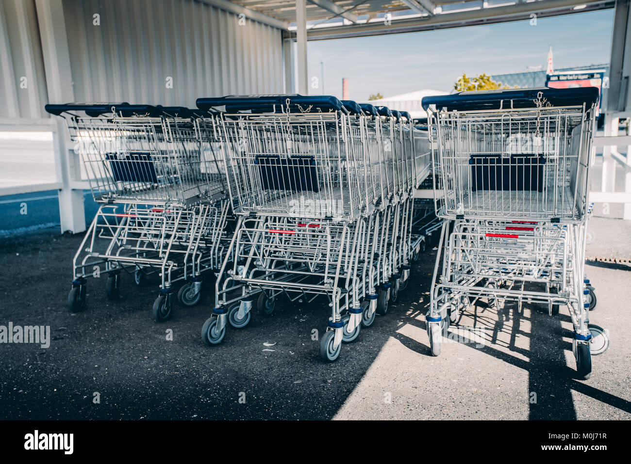 shopping carts. metal shopping carts at the back of a store. shopping