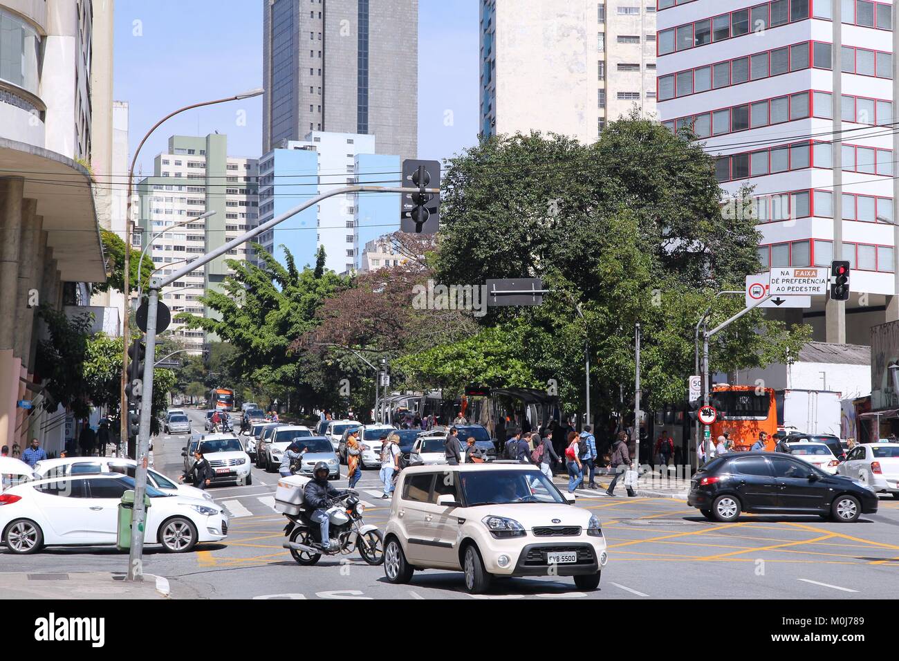 SAO PAULO, BRAZIL - OCTOBER 6, 2014: People drive in Sao Paulo. With 21.2 million people Sao Paulo metropolitan area is the 8th most populous in the w Stock Photo