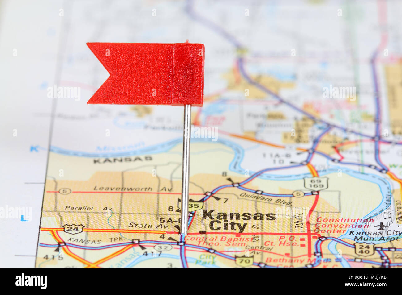 Kansas City, Missouri. Red flag pin on an old map showing travel