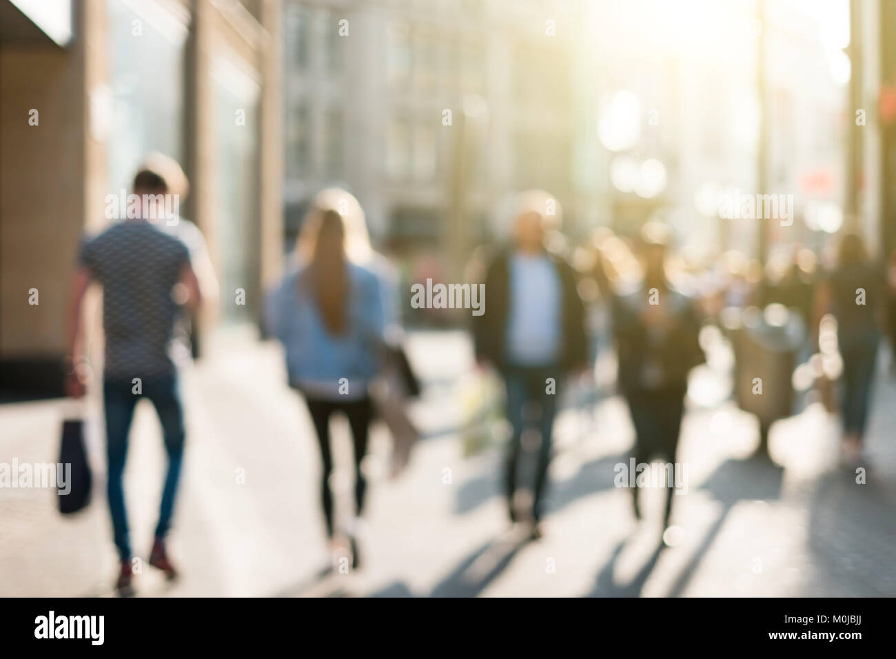 blurred people in a shopping street Stock Photo