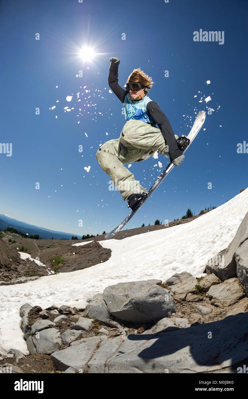 A professional, freeriding snowboarder mid-air on Mount Hood; Oregon, United States of America Stock Photo