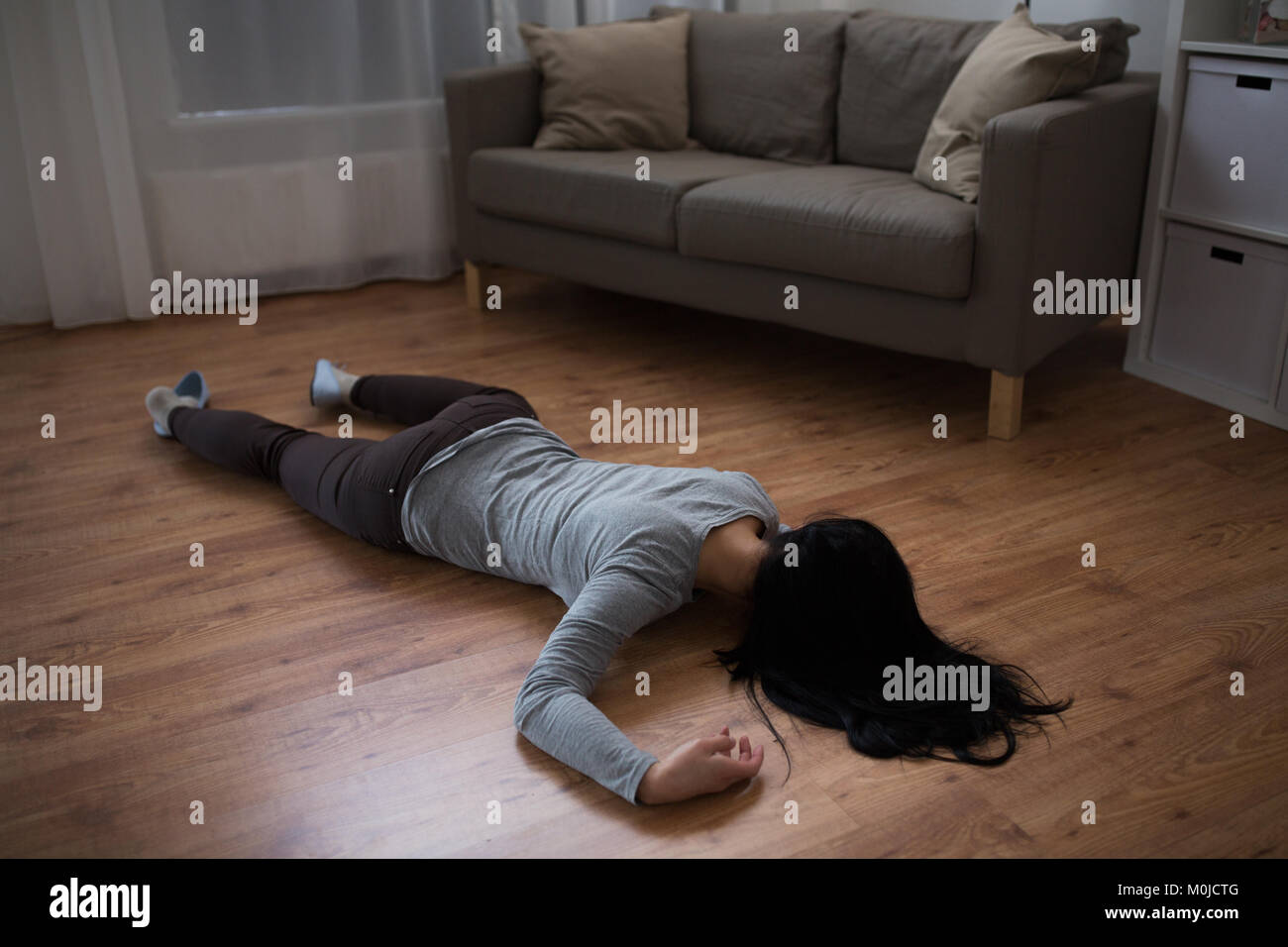 Girl In The Picture Crime En Abime dead woman body lying on floor at crime scene Stock Photo - Alamy