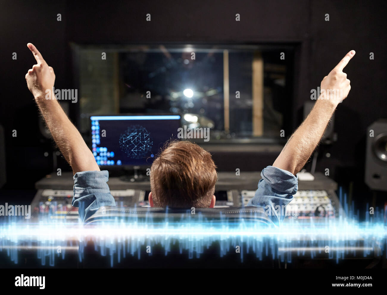 man at mixing console in music recording studio Stock Photo - Alamy