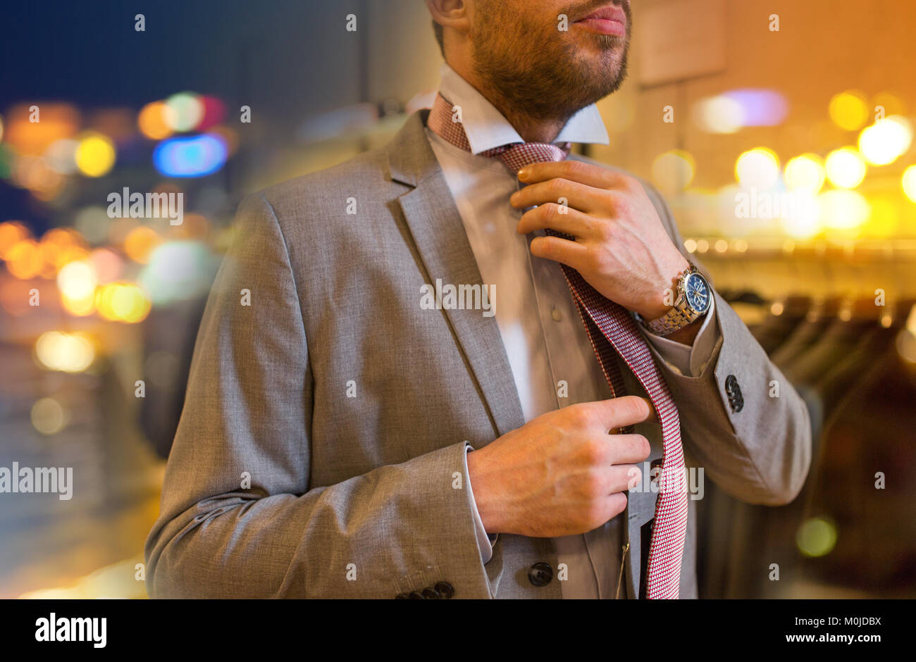 Tying tie hi-res stock photography and images - Alamy