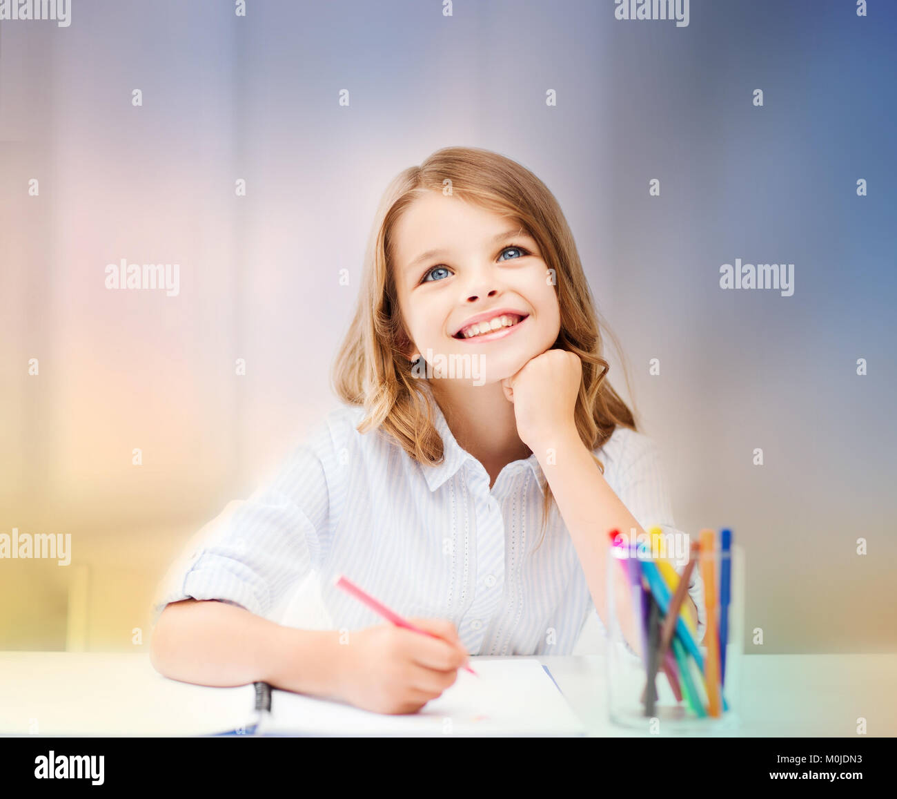 smiling little student girl drawing at school Stock Photo - Alamy