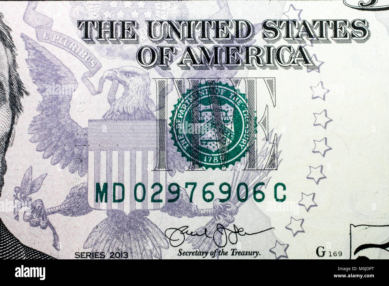 Closeup of a five dollar bill. Stock Photo