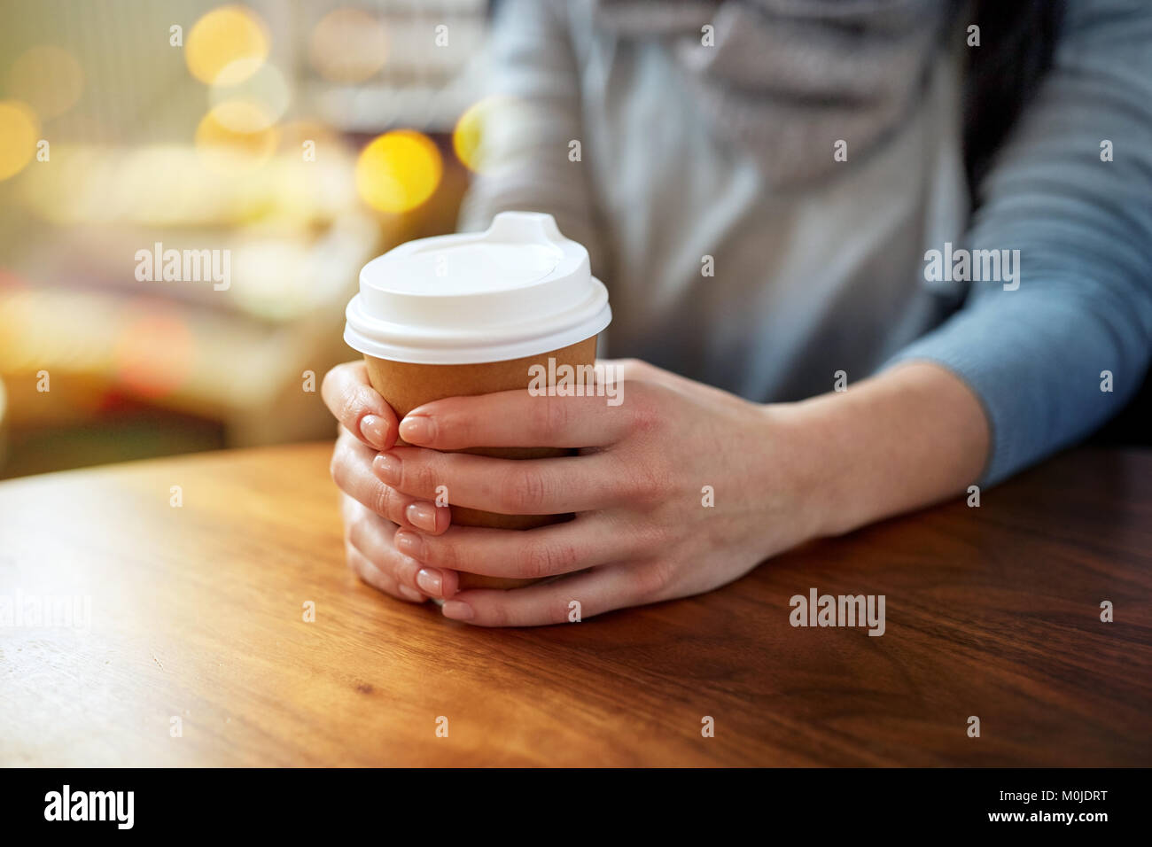 close up of young woman with paper coffee cup Stock Photo