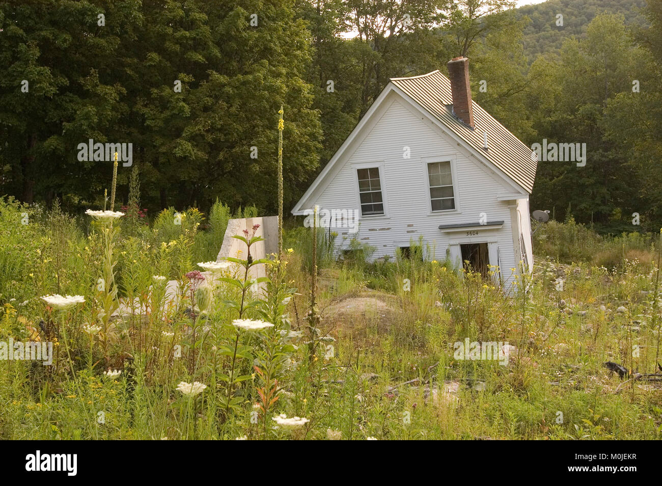 A home moved off it's foundation following flooding in rural Vermont, USA Stock Photo