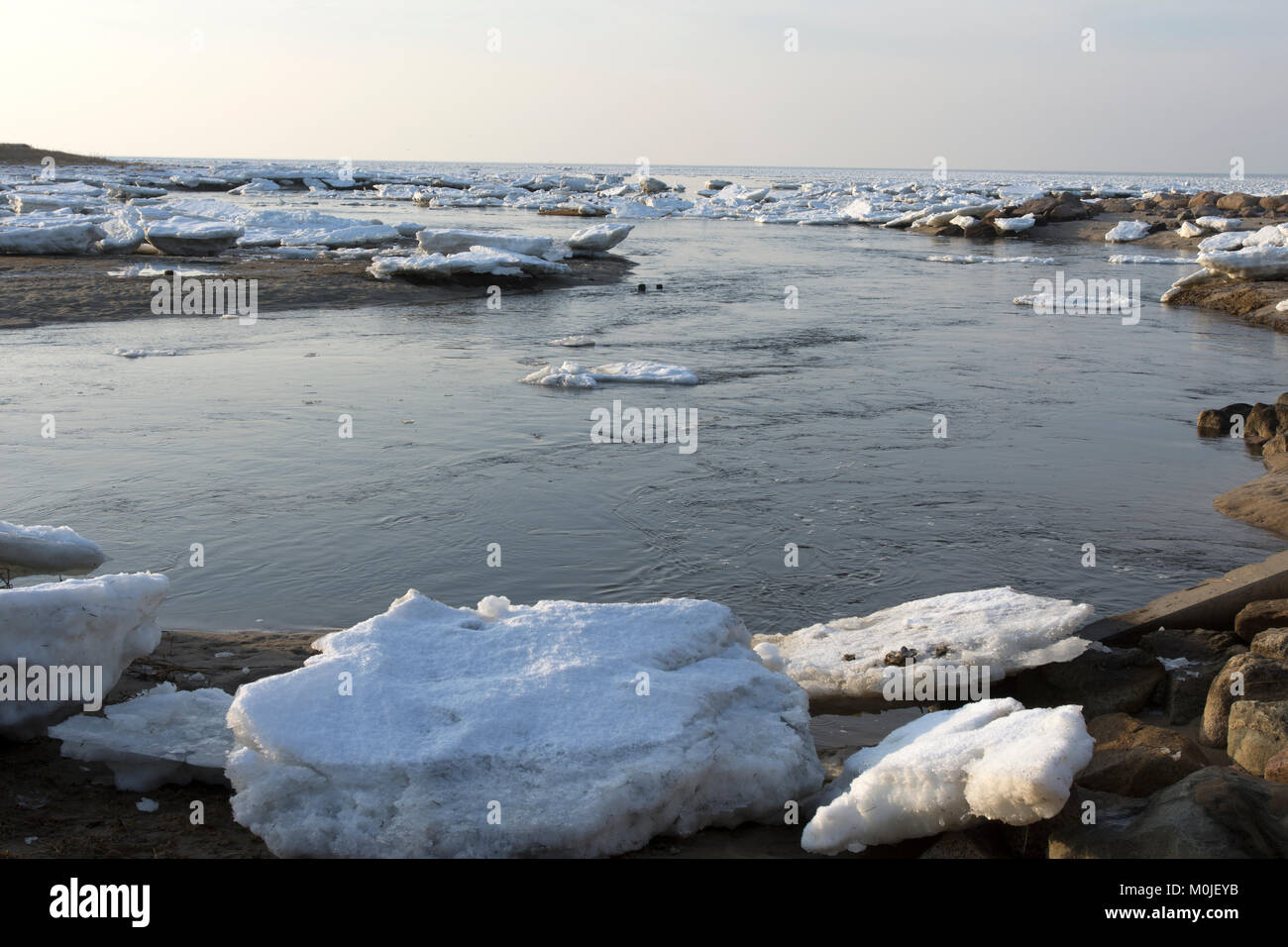 The icy shoreline of Cape Cod Bay in Brewster, Massachusetts, USA on a