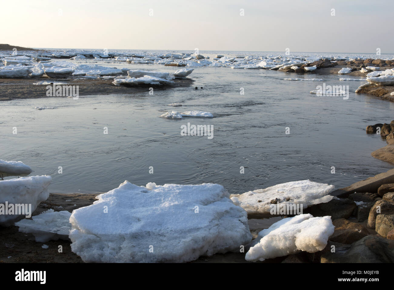 The icy shoreline of Cape Cod Bay in Brewster, Massachusetts, USA on a January day. Stock Photo