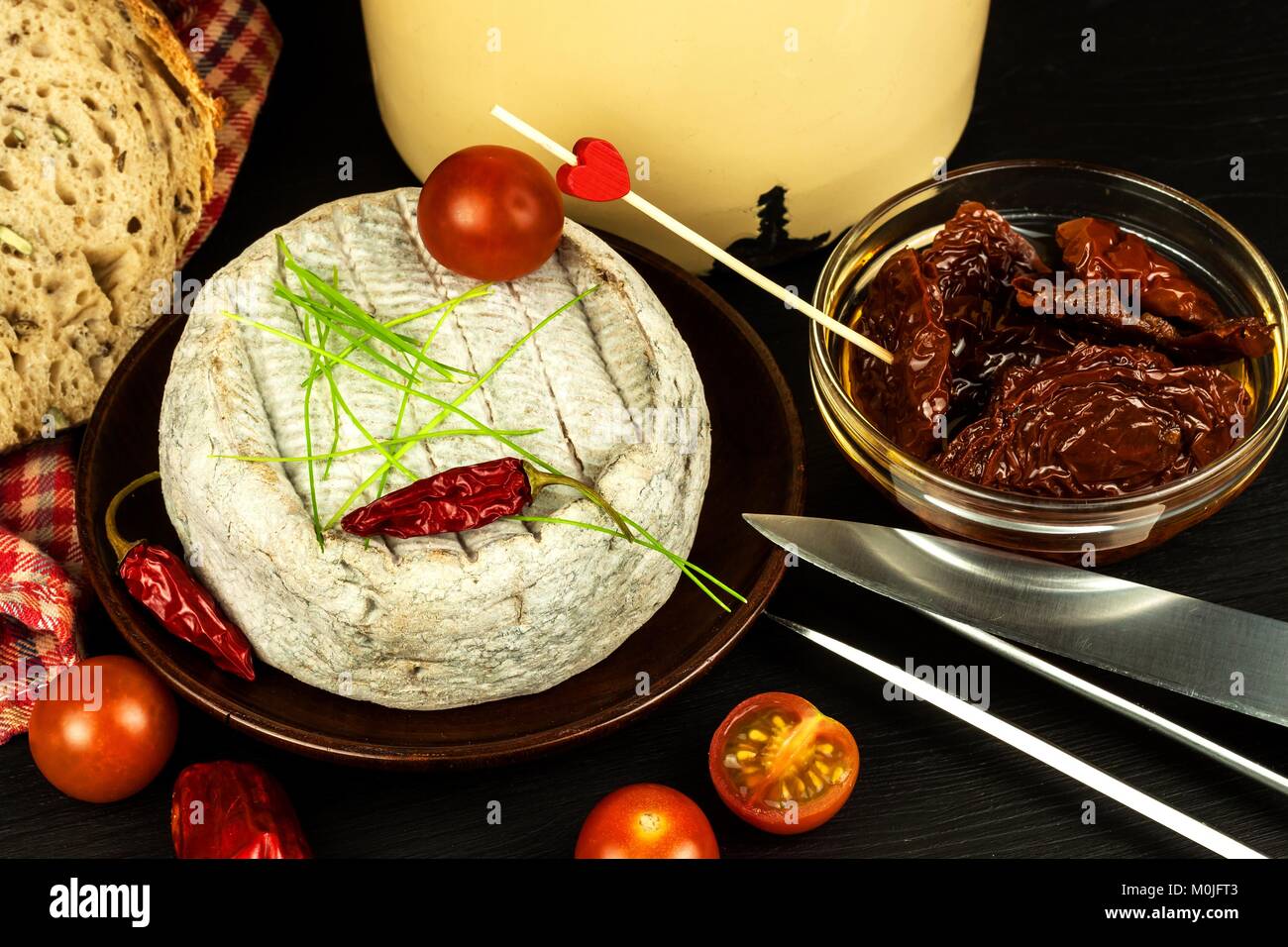 Domestic mature mold cheese. Dairy product. Aromatic cheese with mold Stock Photo