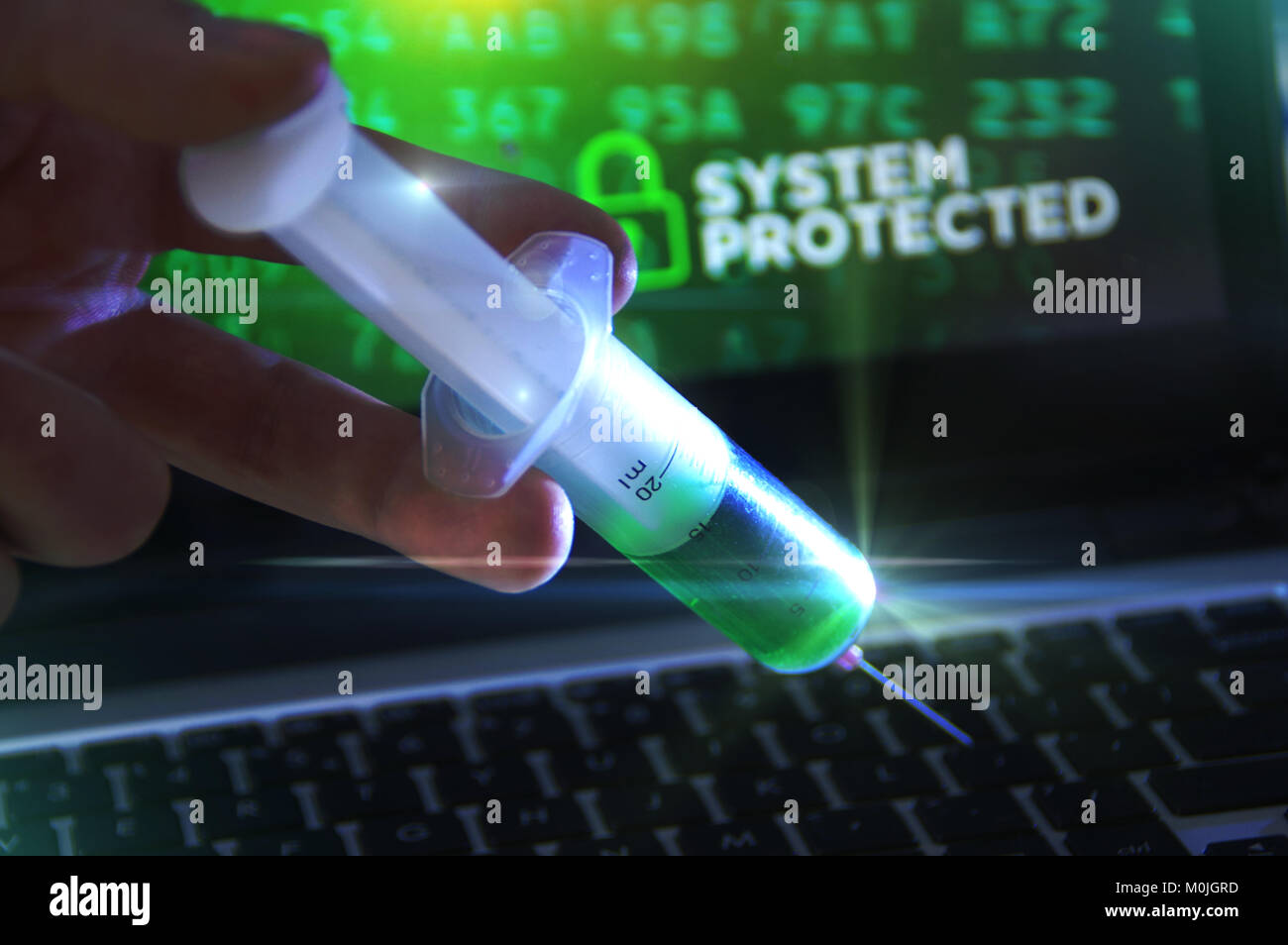Concept of antivirus, system protection and cybersecurity. Vaccination in the syringe on computer keyboard. Stock Photo