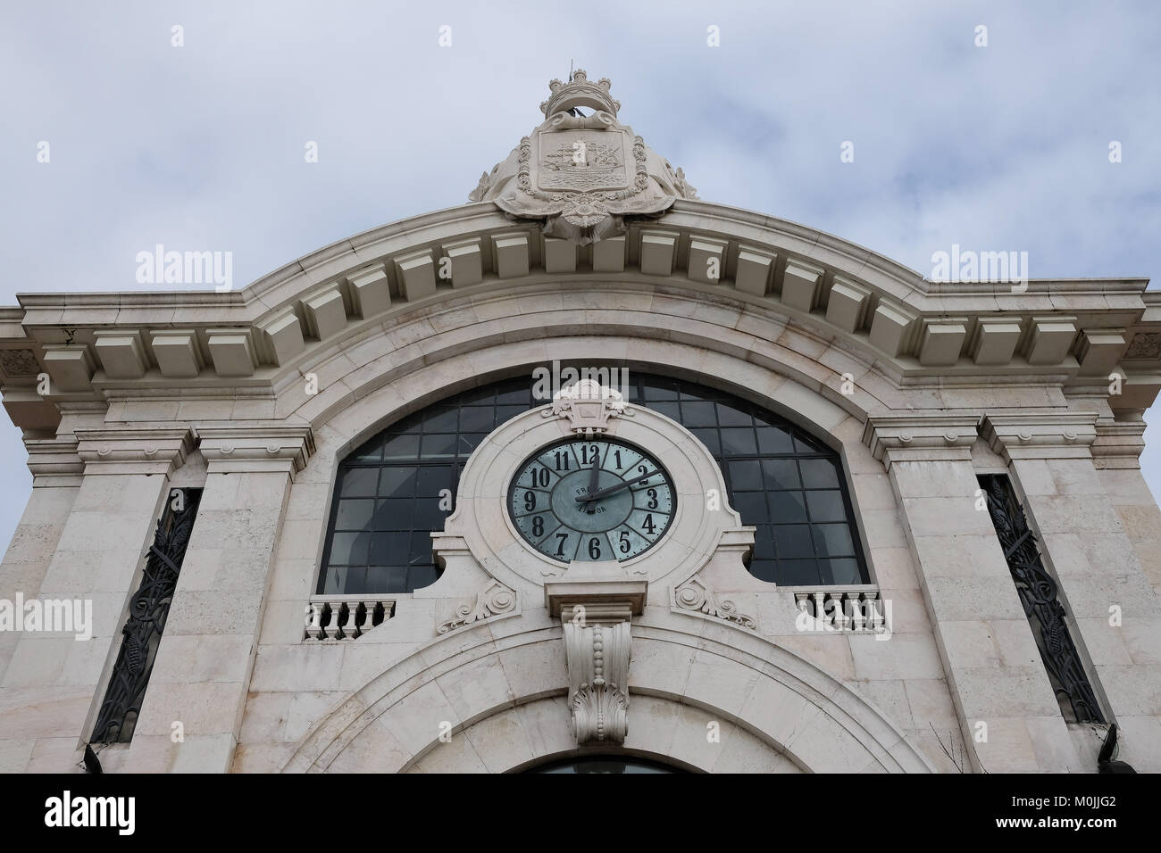 faced of the municipal market of Lisbon, Portugal showing a huge clock