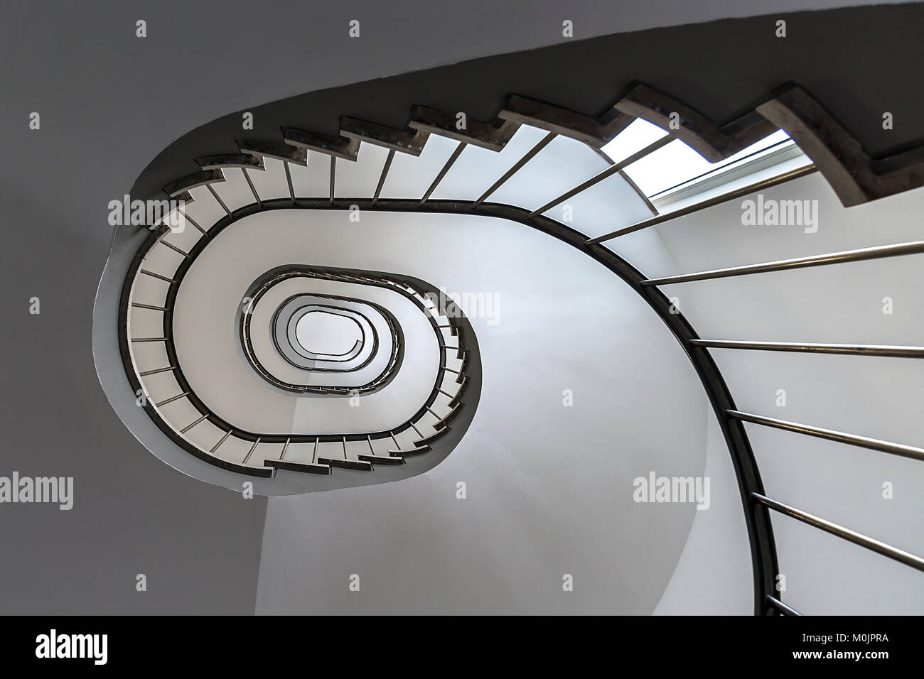 Staircase, architecture of the 1950s, seen from below, Germany Stock Photo