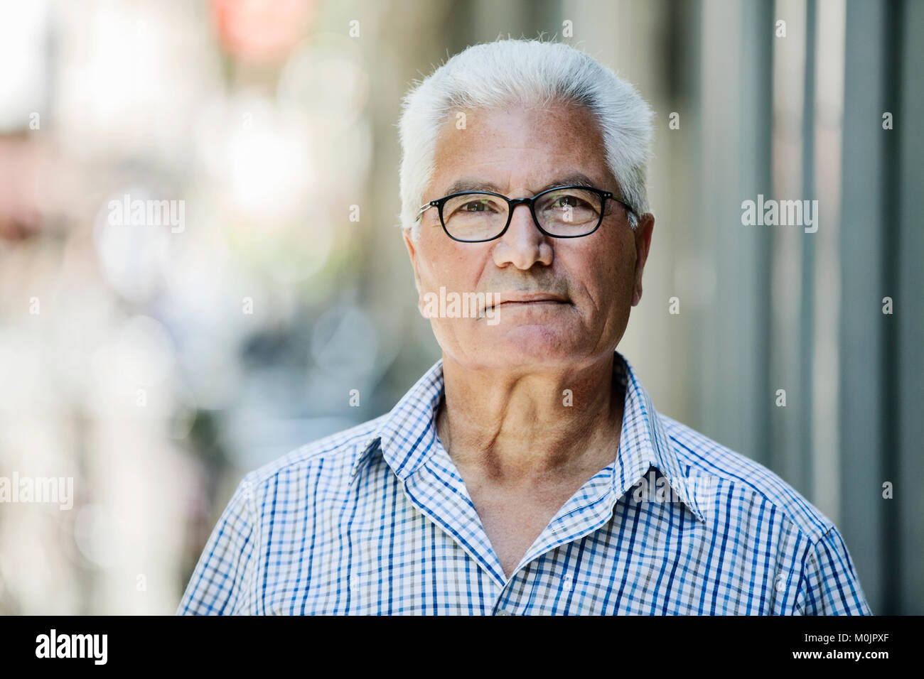 Grey-haired Senior with glasses, migration background, native Italian, portrait, Germany Stock Photo