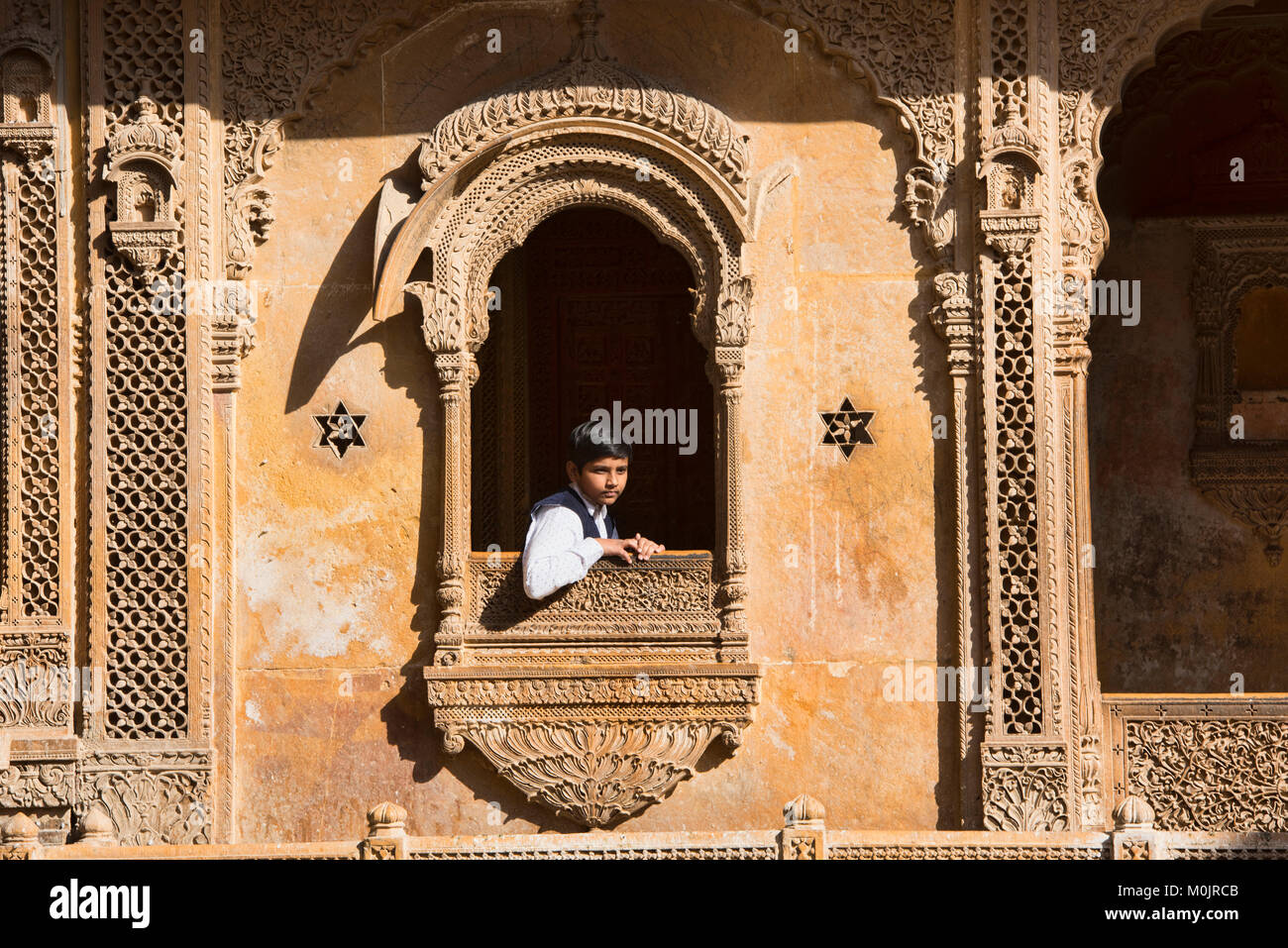 Looking out from the sandstone carved Patwon Ji Ki Haveli, Jaisalmer, Rajasthan, India Stock Photo
