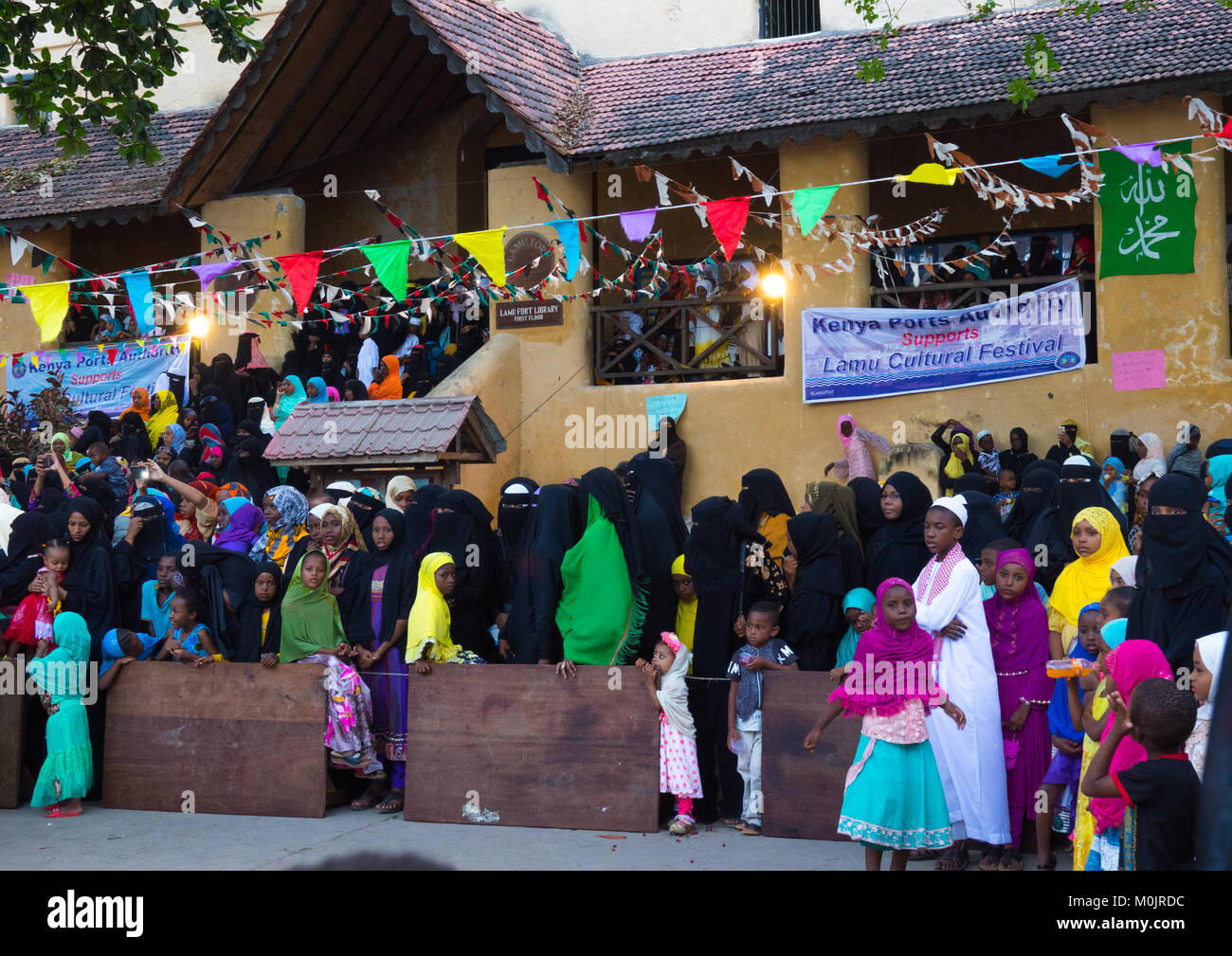 People attending Mawlid celebrations in Lamu main square, Lamu Island, Kenya Stock Photo