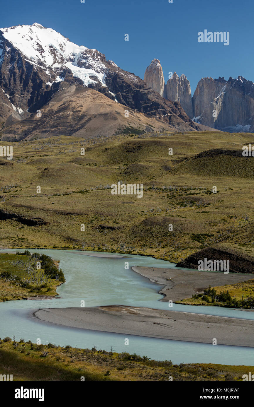 Snow covered peaks of the granite mountains Torres del Paine with the Rio Paine glacial river, Torres del Paine National Park Stock Photo