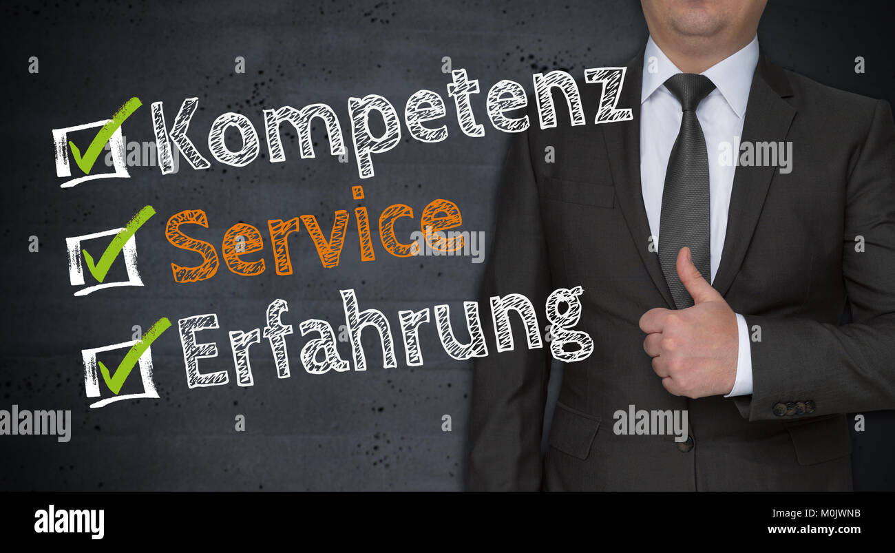 Kompetenz, Service, Erfahrung (in german Competence, service, experience) concept and businessman with thumbs up. Stock Photo
