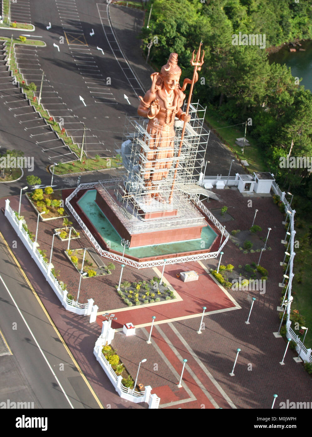 Aerial view of the 108 foot Lord Shiva Statue (Mangal Mahadev) from helicopter, still under construction at The Hindu Temple Complex at Grand Bassin,  Stock Photo