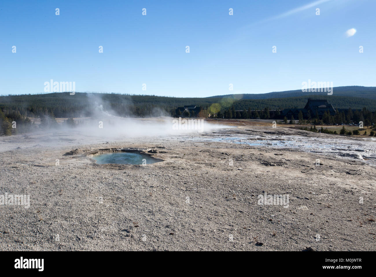 Steam rises off of the Giantess Geyser in the Upper Geyser Basin at the