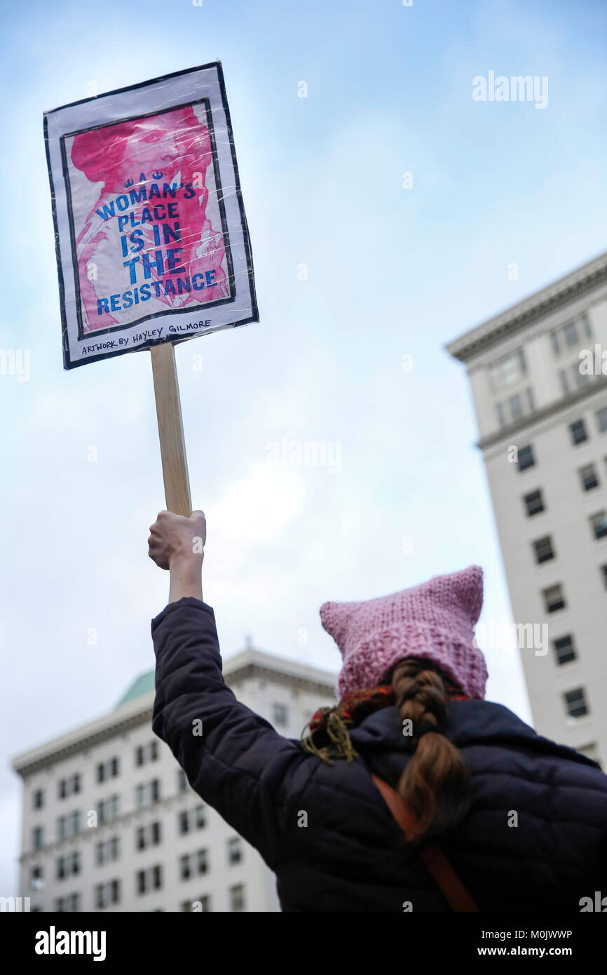 Heather Stahlnecker, of Portland, carries a sign during a rally for women's rights, and against President Donald Trump, on January 20, 2018. Portland, Stock Photo