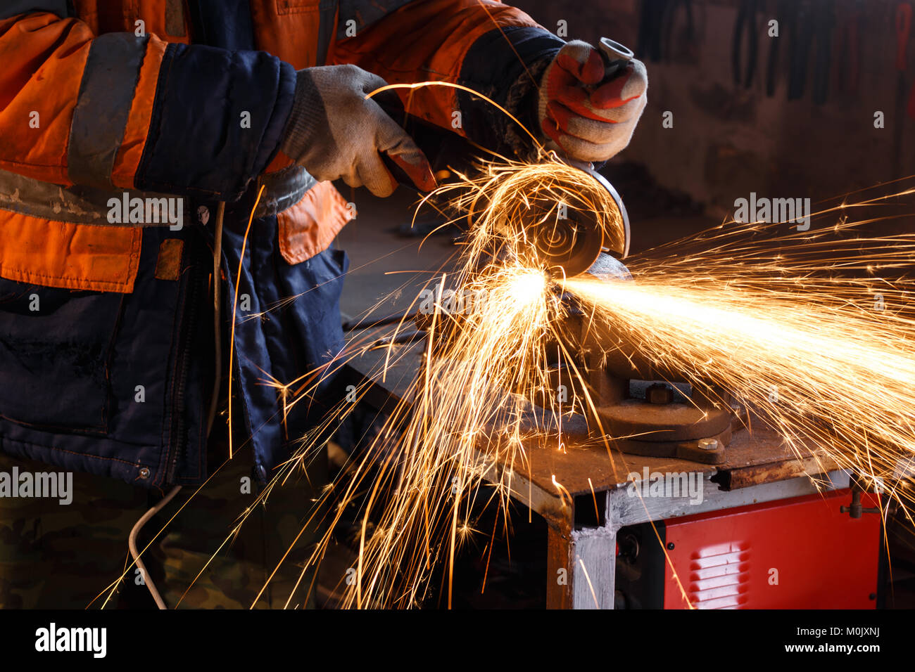 Cutting metal pipe with angle grinder close up Stock Photo Alamy