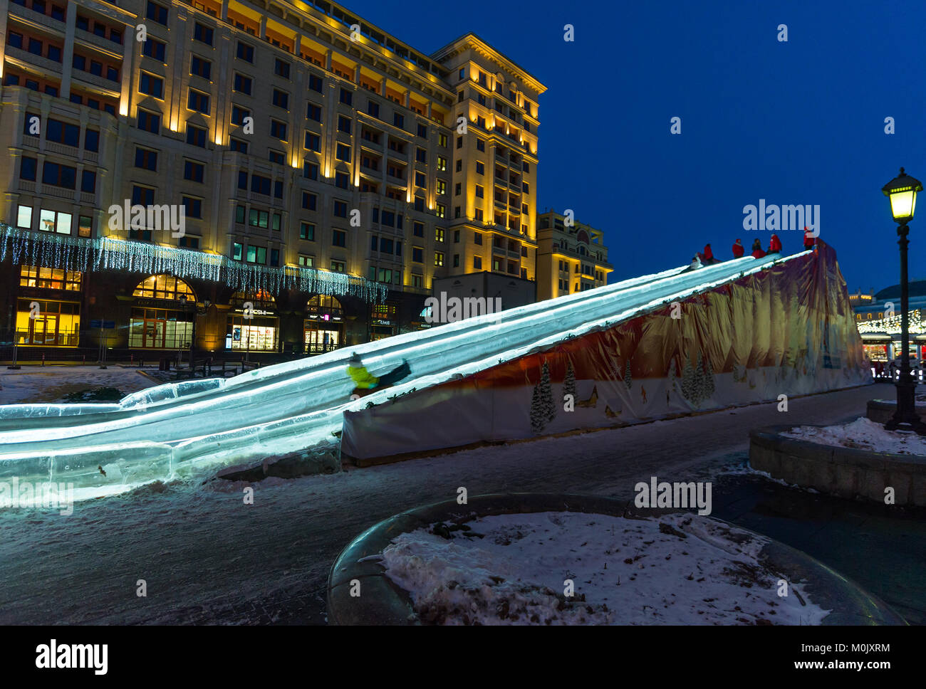 Moscow, Russia - January 10. 2018. Ice slide on Manezhnaya Square as part of festival - trip to Christmas Stock Photo