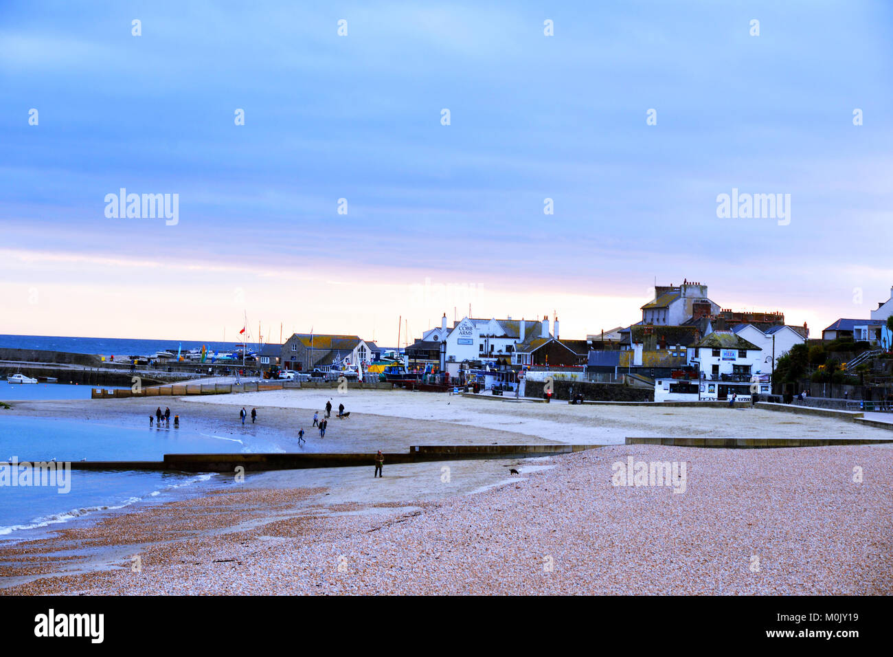Lyme Regis beach at sunset, Dorset UK Stock Photo