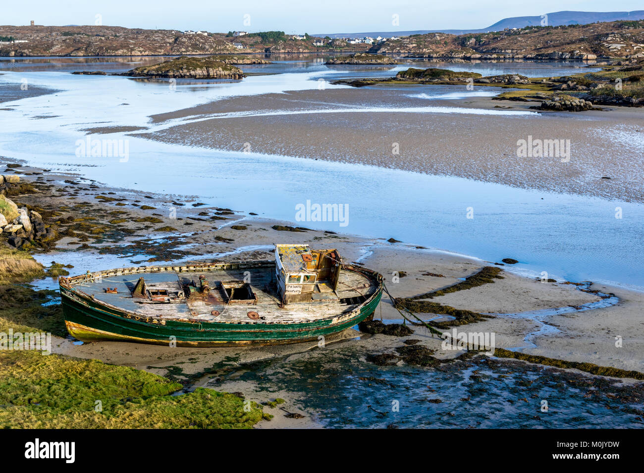 Old wrecked fishing boat on the Donegal Coast in Ireland Stock Photo