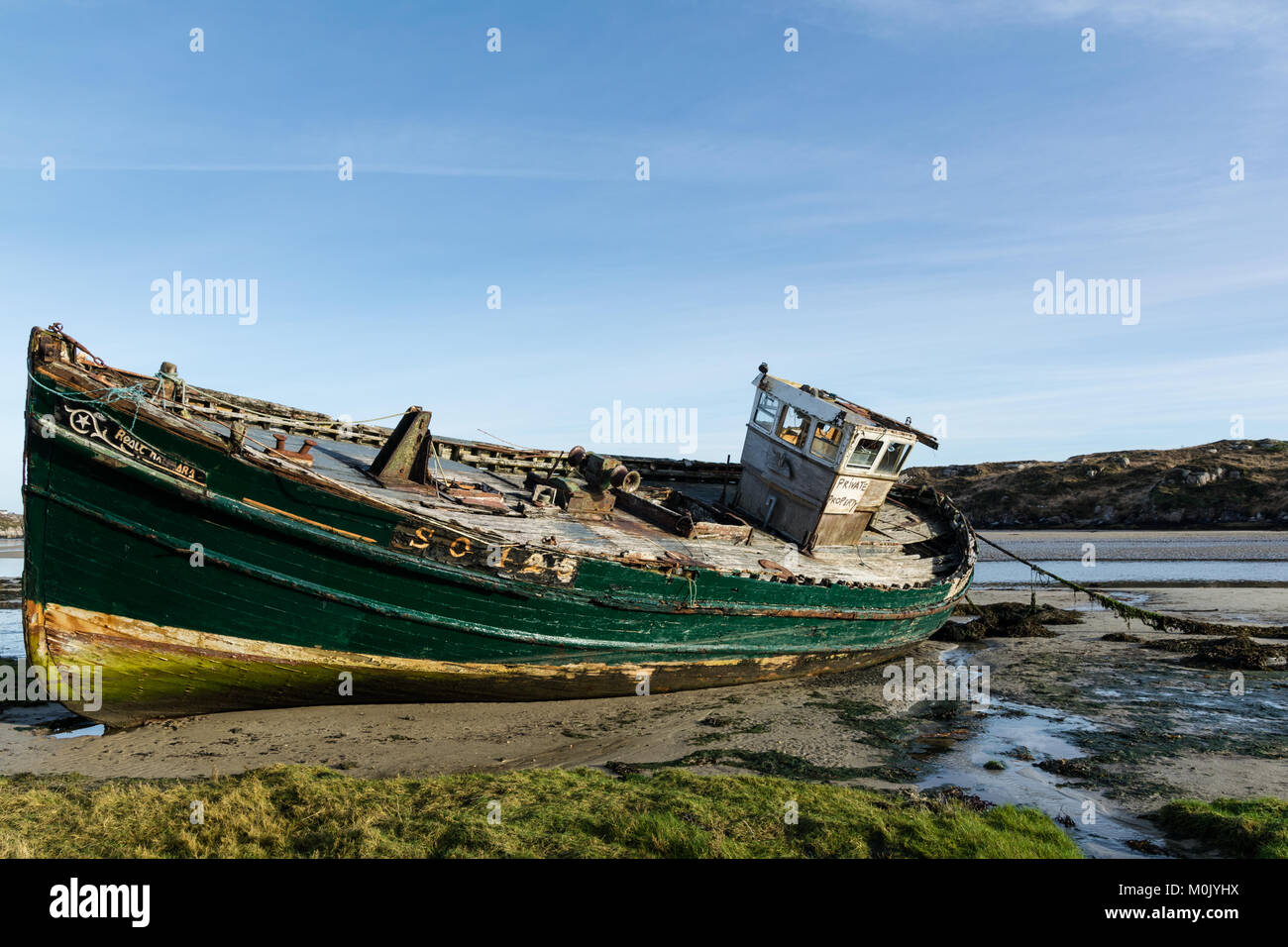 Old wrecked fishing boat on the Donegal Coast in Ireland Stock Photo