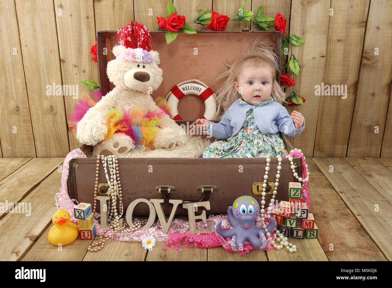 7 months old girl, infant playing in nursery Stock Photo