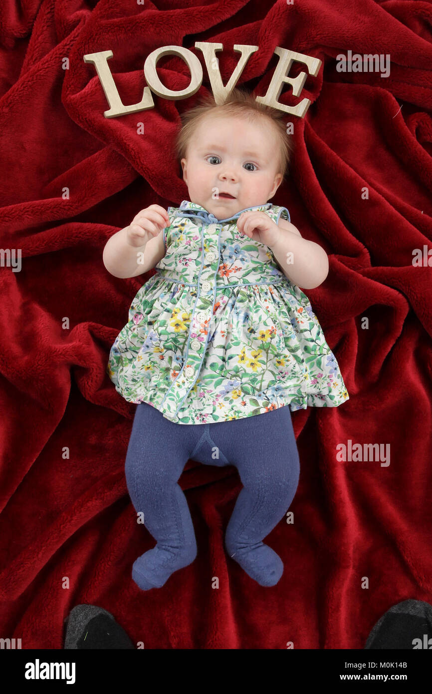 7 months old girl, infant playing in nursery Stock Photo