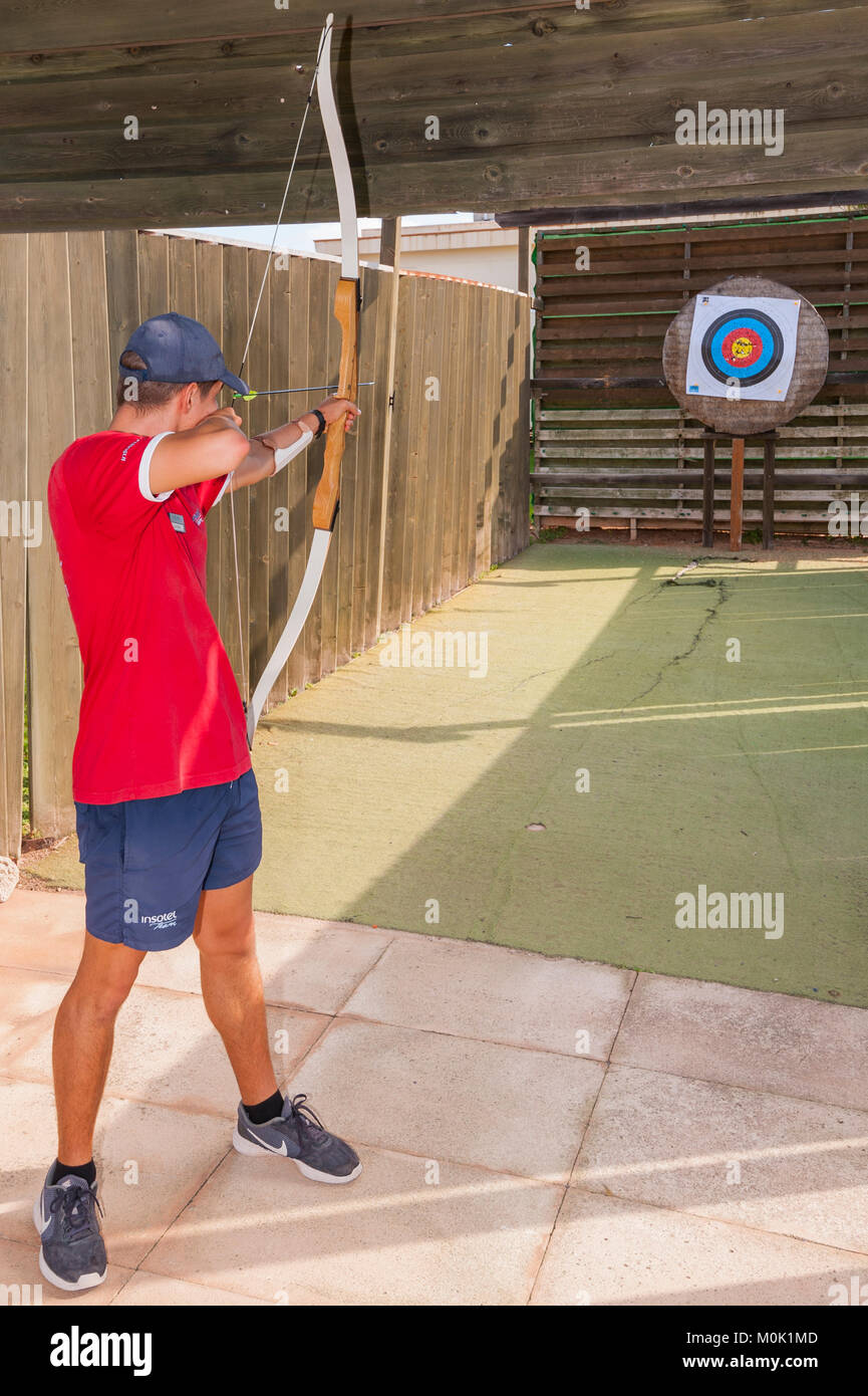 An Archery lesson at the Insotel Club holiday resort in Punta Prima , Menorca , Balearic Islands , Spain Stock Photo